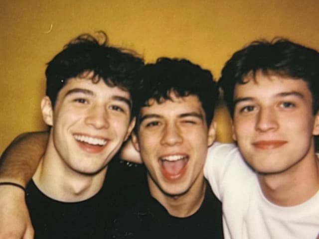 The same three friends pulling a funny face